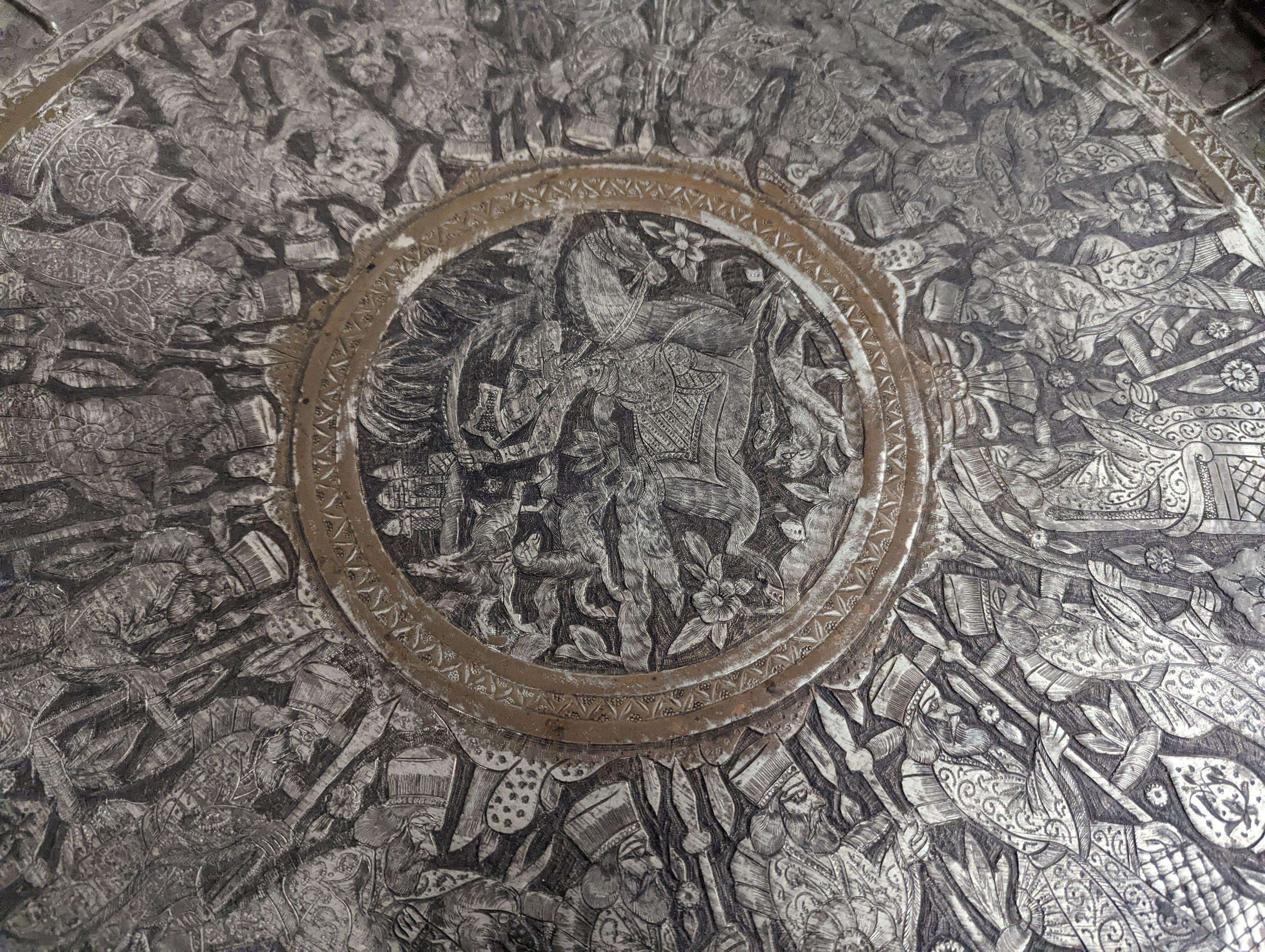 A Persian engraved circular tray, diameter 67cm